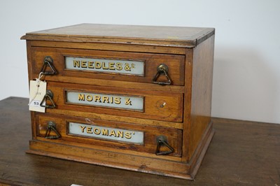 Lot 53 - An early 20th Century table top three drawer oak needle/haberdashery cabinet by Morris & Yeomans.
