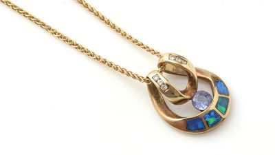 Lot 187 - An opal, diamond and blue stone pendant