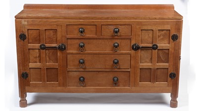 Lot 1335 - Robert 'Mouseman' Thompson of Kilburn: a 1950's 5' panelled English oak sideboard