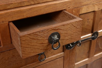 Lot 1335 - Robert 'Mouseman' Thompson of Kilburn: a 1950's 5' panelled English oak sideboard