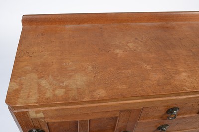 Lot 1335 - Robert 'Mouseman' Thompson of Kilburn: a 1950's 5' panelled English oak sideboard