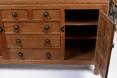 Lot 1335 - Robert 'Mouseman' Thompson of Kilburn: a 1950's 5' panelled English oak sideboard