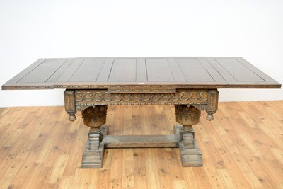 Lot 37 - An impressive mid 20th Century Jacobean revival carved oak extending dining table