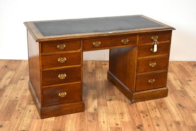 Lot 9 - A late 19th Century oak pedestal writing desk