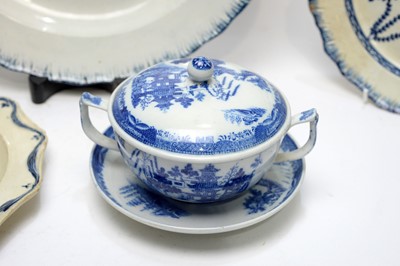 Lot 896 - Pearlware charger, three plates, écuelle cover and stand