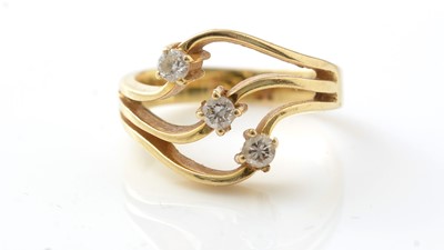 Lot 173 - A three stone diamond ring