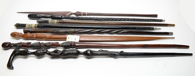 Lot 401 - A collection of African walking sticks and spears