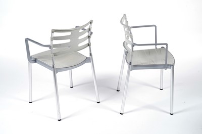 Lot 27 - A contemporary chrome and glass tilt action table / Fritz Hansen - Ice dining chair by Kaspar Salto