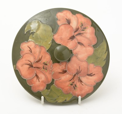 Lot 100 - Moorcroft Hibiscus bowl and cover, plate and small bowl