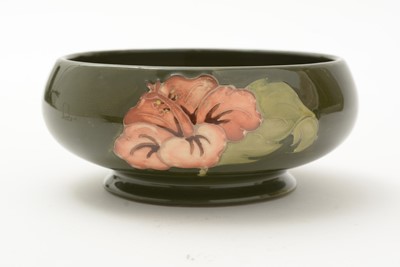 Lot 100 - Moorcroft Hibiscus bowl and cover, plate and small bowl