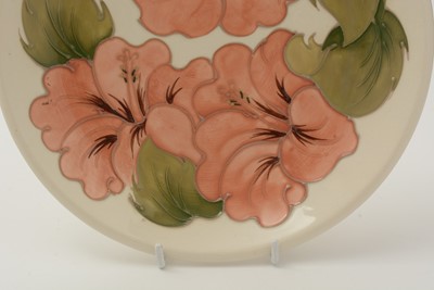 Lot 100 - Moorcroft Hibiscus bowl and cover, plate and small bowl