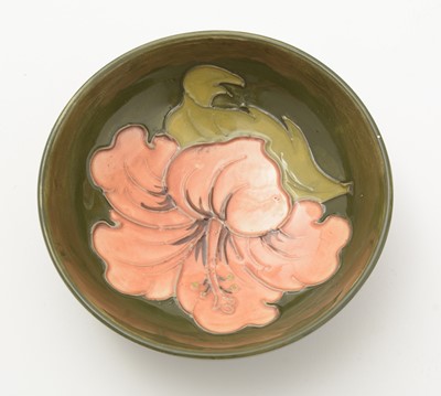 Lot 100 - Moorcroft Hibiscus bowl and cover, plate and small bowl