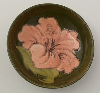 Lot 100 - Moorcroft Hibiscus bowl and cover, plate and small bowl