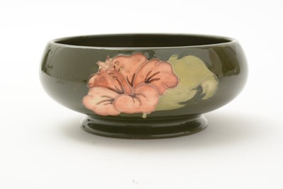 Lot 100 - Moorcroft Hibiscus bowl and cover, plate and small bowl
