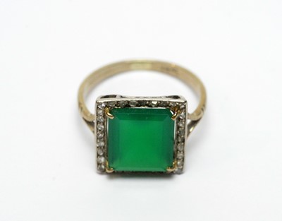 Lot 96 - A green glass and diamond cluster dress ring