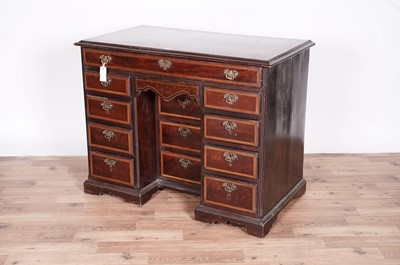 Lot 43 - A George III mahogany and satinwood banded kneehole desk