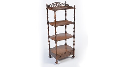 Lot 944 - A Victorian rosewood four-tier serpentine whatnot
