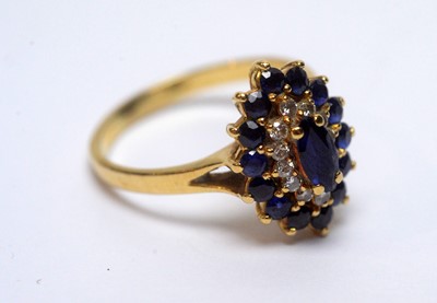 Lot 98 - A sapphire and diamond cluster ring