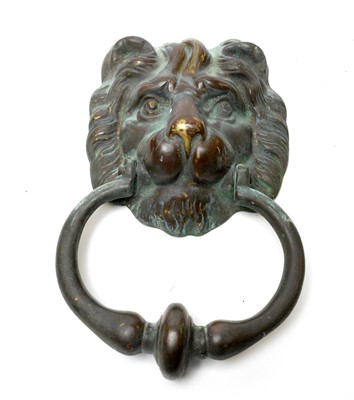 Lot 723 - A patinated brass lion mask door knocker