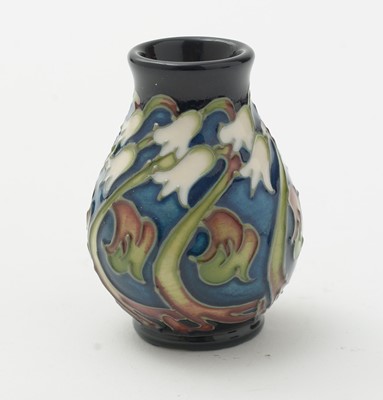Lot 105 - Moorcroft pin tray, another. two small vases and an enamel box.