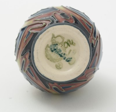 Lot 105 - Moorcroft pin tray, another. two small vases and an enamel box.