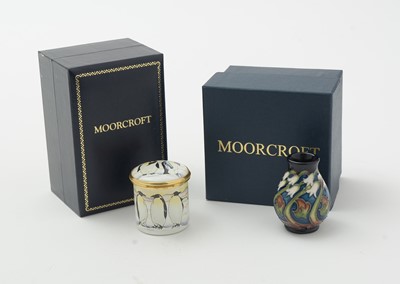 Lot 105 - Moorcroft pin tray, another. two small vases and an enamel box.