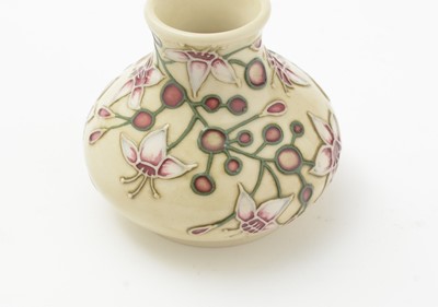 Lot 105 - Moorcroft pin tray, another. two small vases and an enamel box.