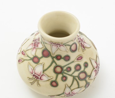 Lot 105 - Moorcroft pin tray, another. two small vases and an enamel box.