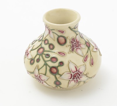 Lot 105 - Moorcroft pin tray, another. two small vases and an enamel box.