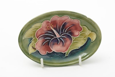 Lot 105 - Moorcroft pin tray, another. two small vases and an enamel box.