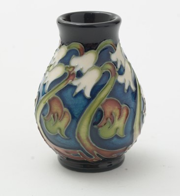 Lot 105 - Moorcroft pin tray, another. two small vases and an enamel box.