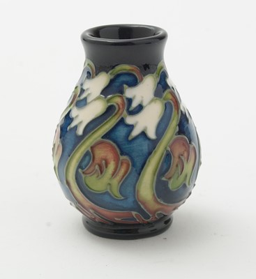 Lot 105 - Moorcroft pin tray, another. two small vases and an enamel box.
