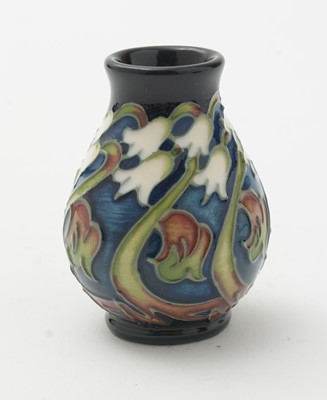 Lot 105 - Moorcroft pin tray, another. two small vases and an enamel box.