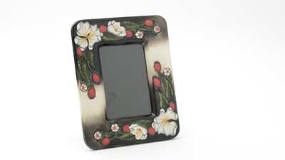 Lot 107 - Moorcroft 'Christmas pride' photograph frame, boxed.