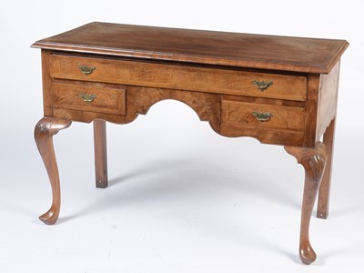 Lot 1464 - A walnut and herringbone banded dressing table in the Georgian taste