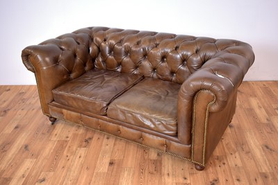 Lot 42 - A modern brown leather Chesterfield sofa