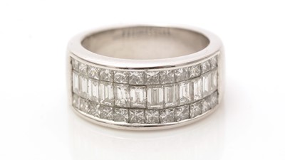 Lot 682 - A diamond half-hoop eternity ring