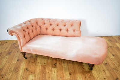 Lot 1 - Howard & Sons Ltd: A Victorian chaise longue upholstered in salmon pink fabric