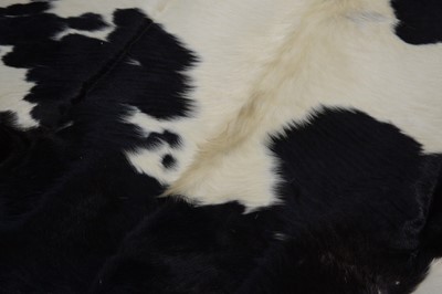 Lot 70 - A cow hide rug