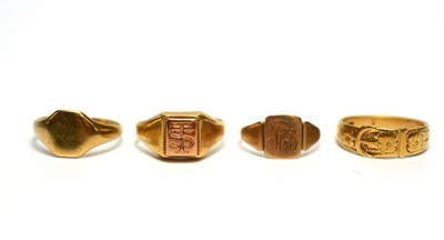 Lot 90 - A gold buckle ring; two gold signet rings; and another