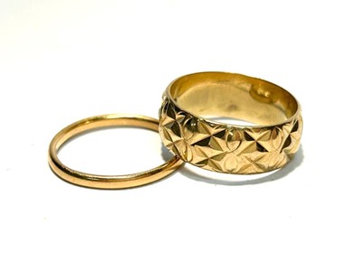 Lot 149 - A 22ct gold wedding band and an 18ct gold wedding band