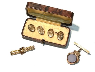 Lot 148 - A Victorian yellow metal bar brooch and a pair of cufflinks