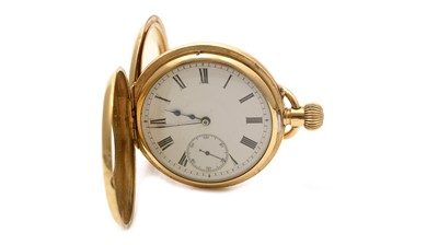 Lot 517 - Goldsmiths & Silversmiths Co Ltd (retailers): an 18ct yellow gold cased half-hunter pocket watch
