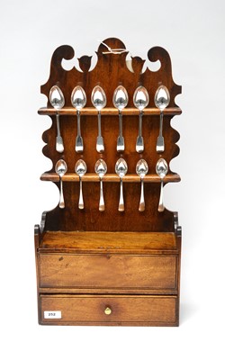 Lot 252 - A 19th Century oak wall mounting spoon stand