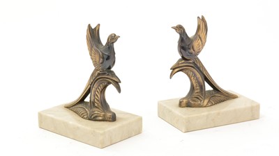 Lot 744 - A pair of Art Deco gilt and patinated metal garnitures