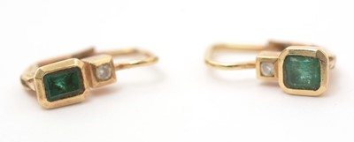 Lot 164 - A pair of emerald and diamond earrings