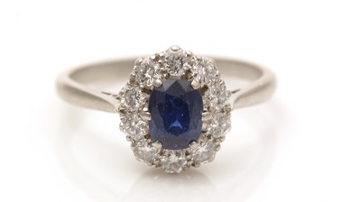 Lot 660 - A sapphire and diamond cluster ring