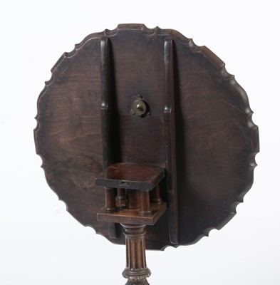 Lot 1490 - A George III style well-carved mahogany tilt-action table