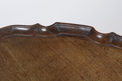 Lot 1490 - A George III style well-carved mahogany tilt-action table