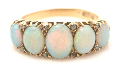 Lot 788 - An early 20th Century five stone opal ring